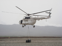 MI8 Russian Helicopter in Afghanistan Carrying Fuel Container to a FOB